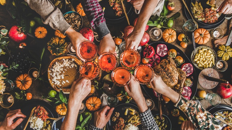 overhead photo of thanksgiving party with lots of food.