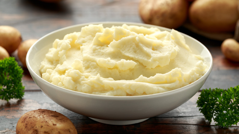 Bowl of mashed potatoes on table
