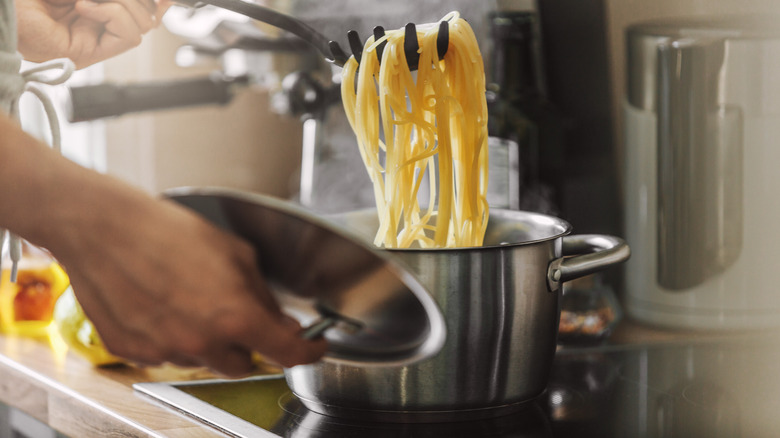 lifting pasta noodles