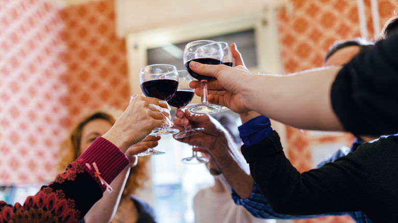 People toasting in a living room