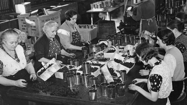 women canning food