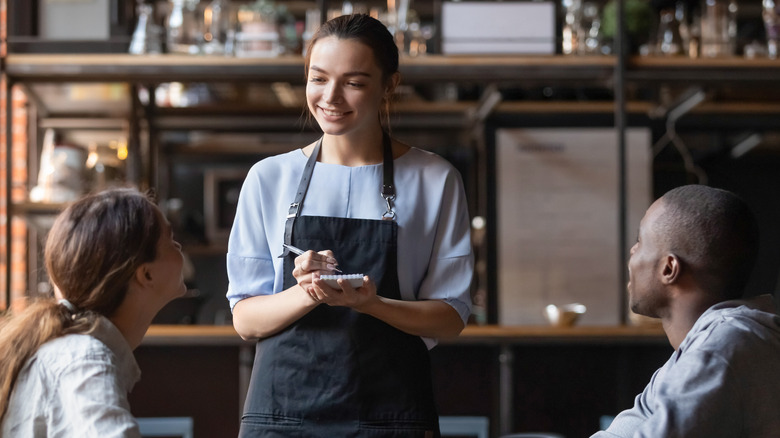 Waitress taking order