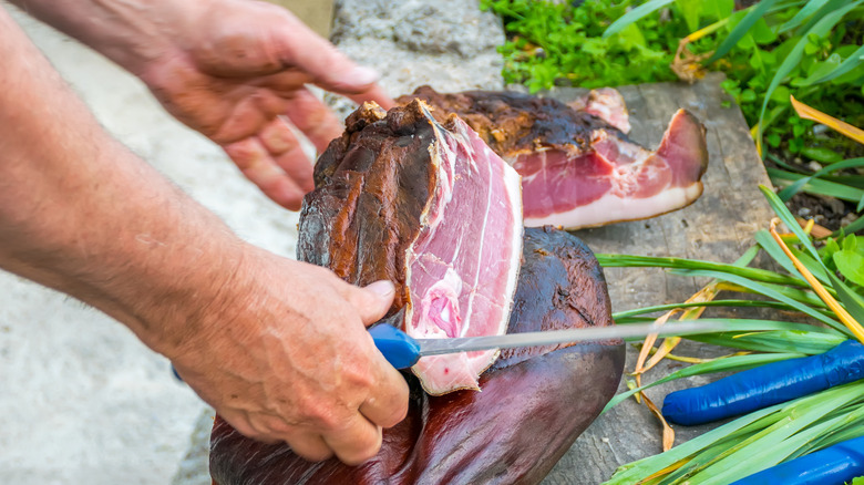 A man cutting meat