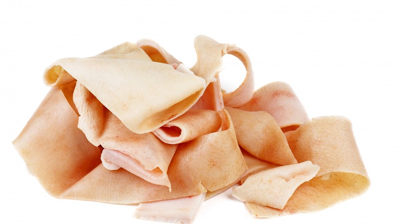 raw pork skin on white background