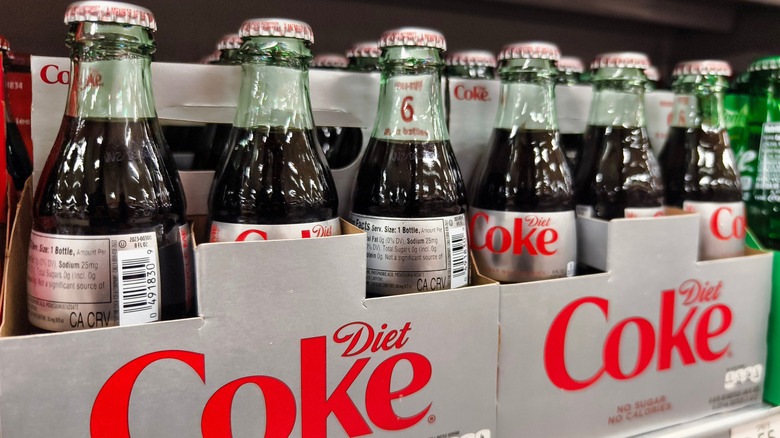 Glass bottles of Diet Coke in a grocery store