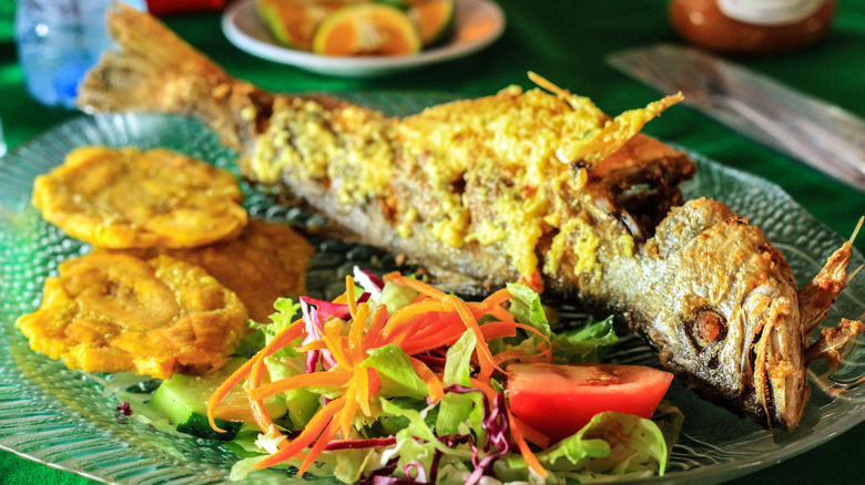 puerto rican fried fish with plantains and salad