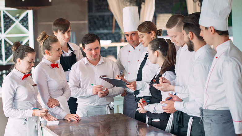 Restaurant staff having a meeting