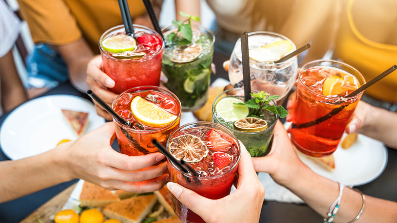 Friends enjoying happy hour drinks at a restaurant