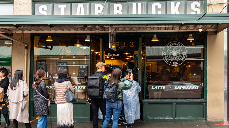 Customers line up at Starbucks Pike Place location 