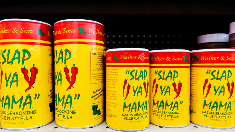 Containers of Slap Ya Mama Cajun seasoning