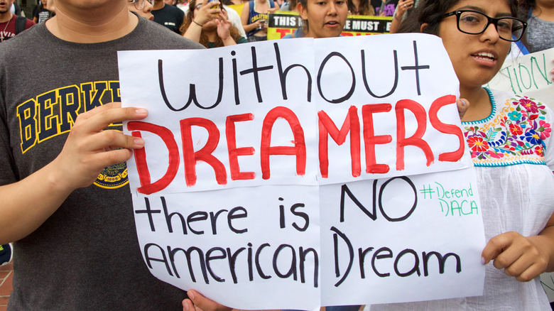 DACA supporter holding sign supporting dreamers