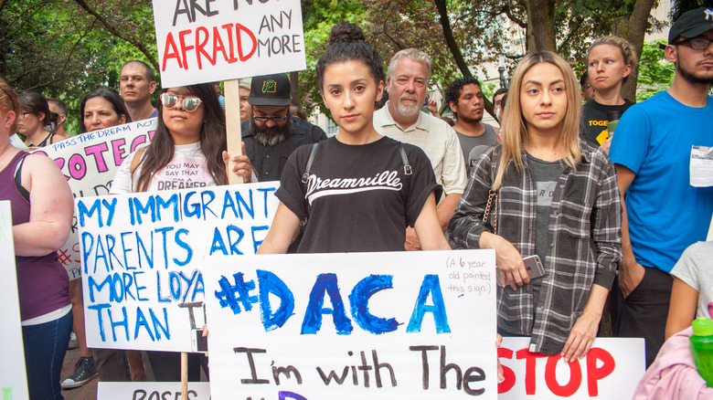 DACA supporters holding rally signs