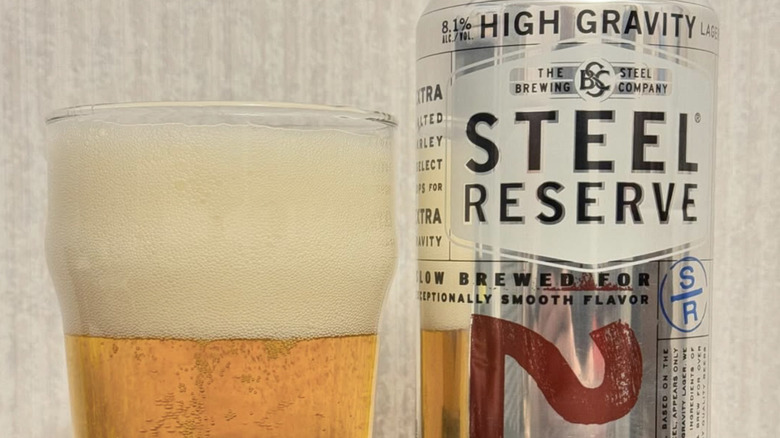 a glass and can of Steel Reserve beer next to each other