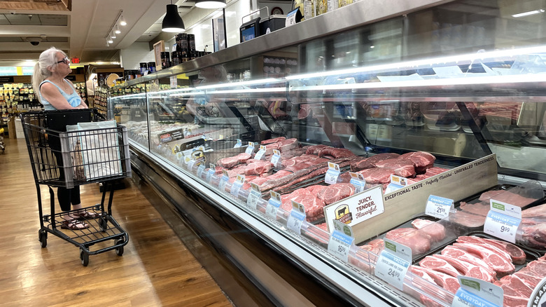 Grocery shopper browsing the meat counter