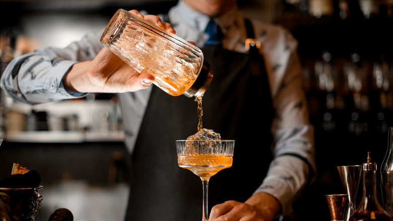 bartender pouring cocktail