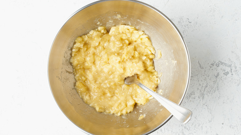 mashed bananas in a metal bowl