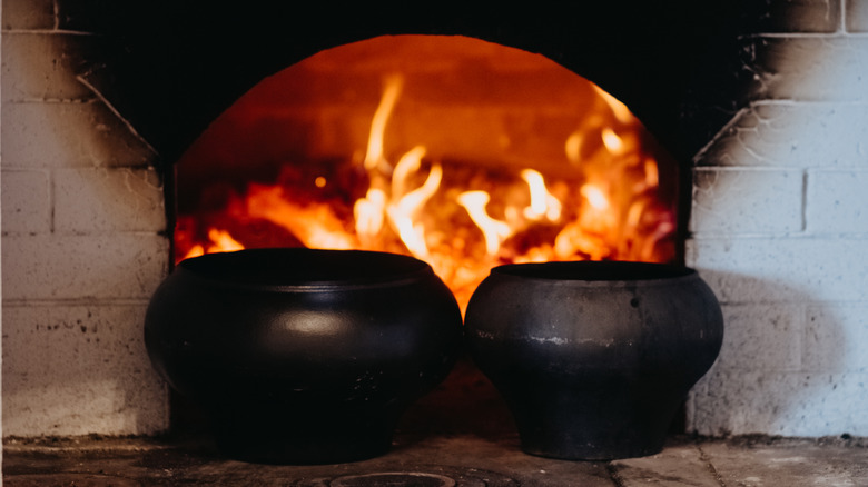 wood fire oven with cooking pots