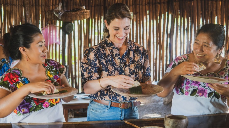 Pati Jinich and chefs in Yucatán sampling food