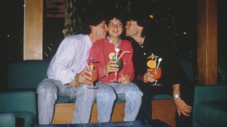 vintage photo of people holding cocktails