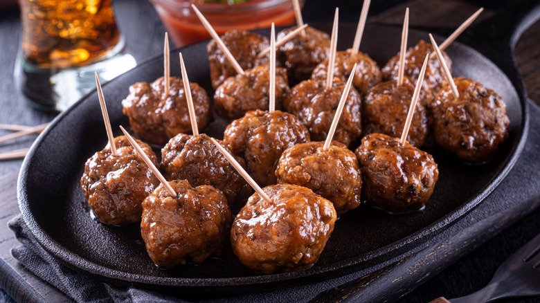 Meatballs with toothpicks in them