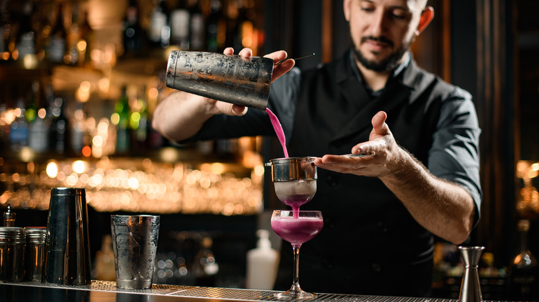 Bartneder making purple drink 