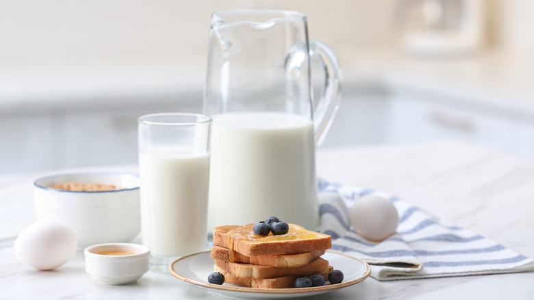 stack of toast in front of milk