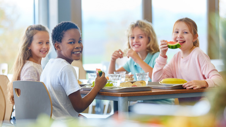 Group of kids eating lunch at school