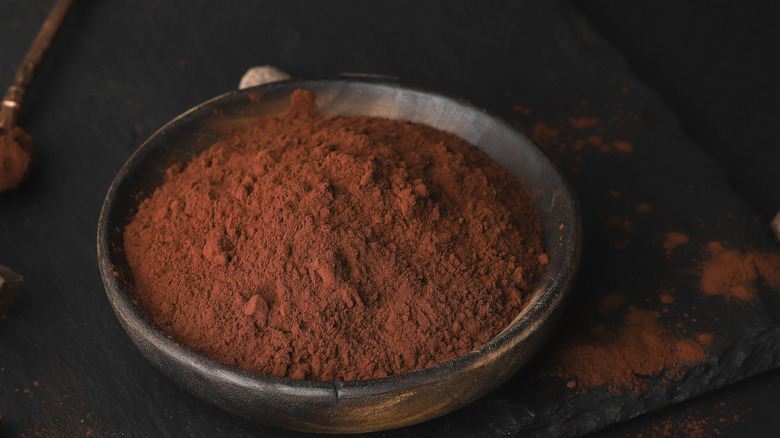 cocoa powder in a dark bowl