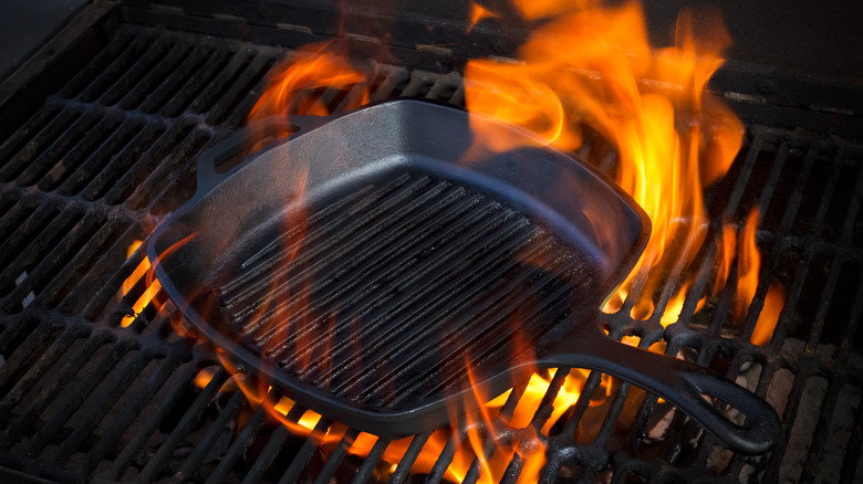 cast iron skillet on flames