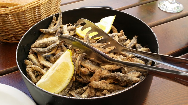 bowl of crispy sardines with lemon