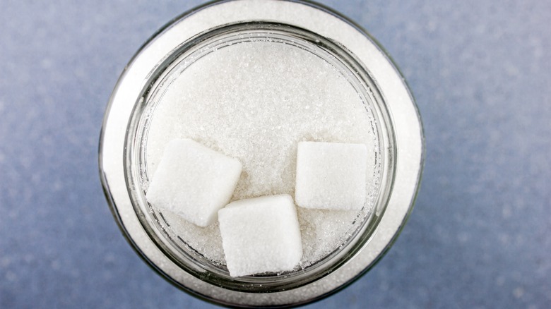 Sugar and sugar cubes in a jar.