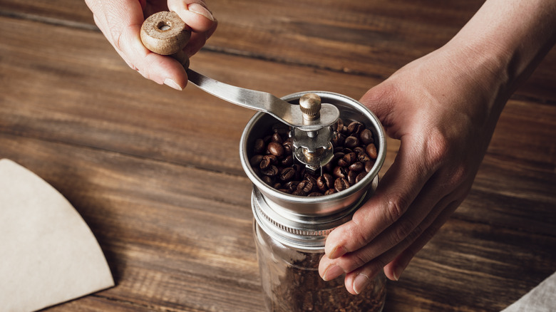 coffee falling into grinder