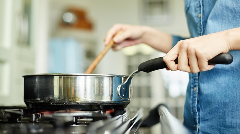 cooking with saucepan