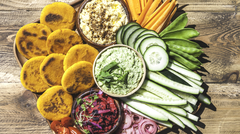 Colorful crudite platter on wood board