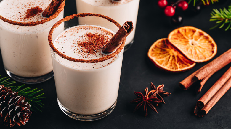 glasses of spiked eggnog with cinnamon for the holidays