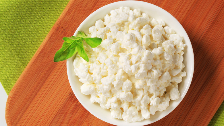 bowl of cottage cheese on board