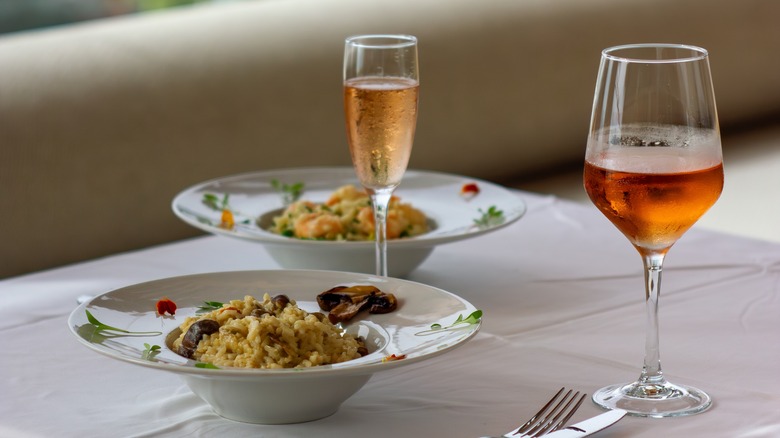risotto table set with different types of wine