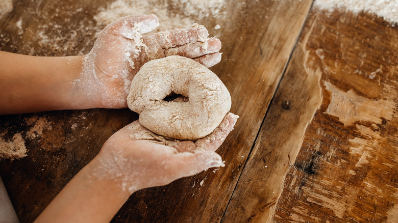 child making dough for bagels