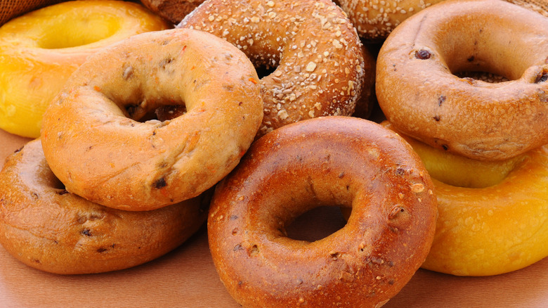 assorted bagels on wood table