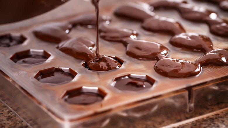 Pouring chocolate in mold