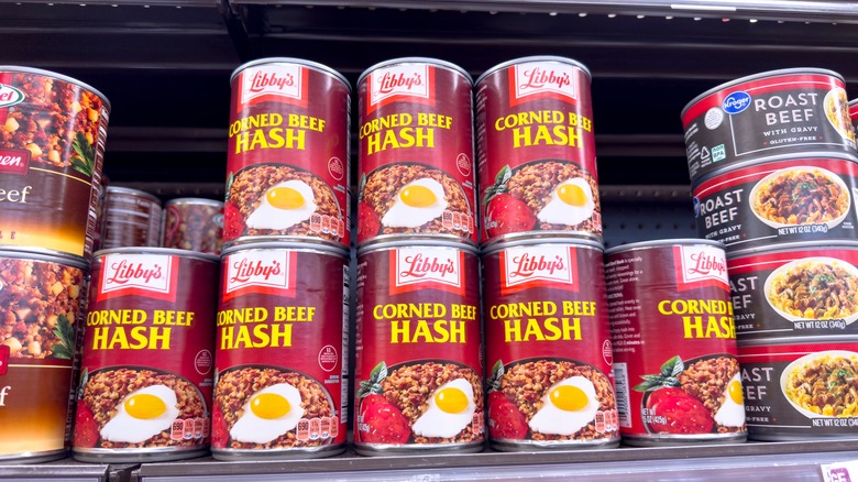 Canned corned beef hash on supermarket shelf