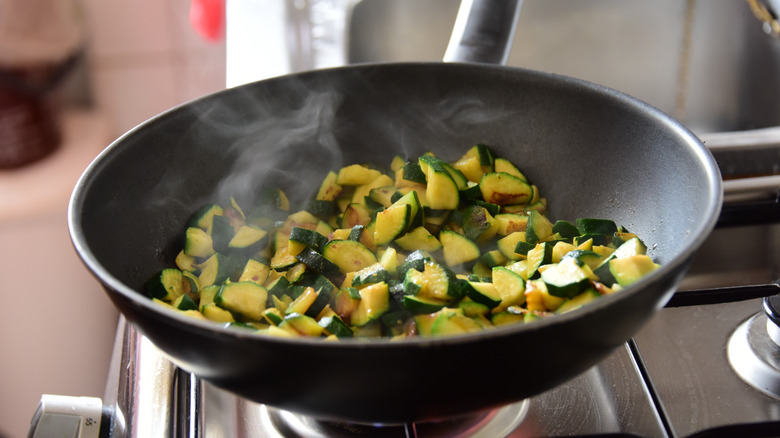 cucumbers frying in a pan