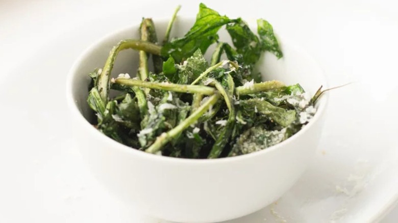 Sauteed dandelion greens in a small bowl