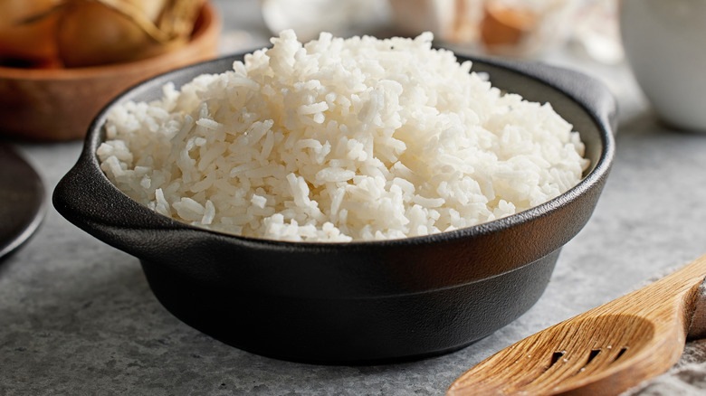 Bowl of fluffy rice served in a black bowl