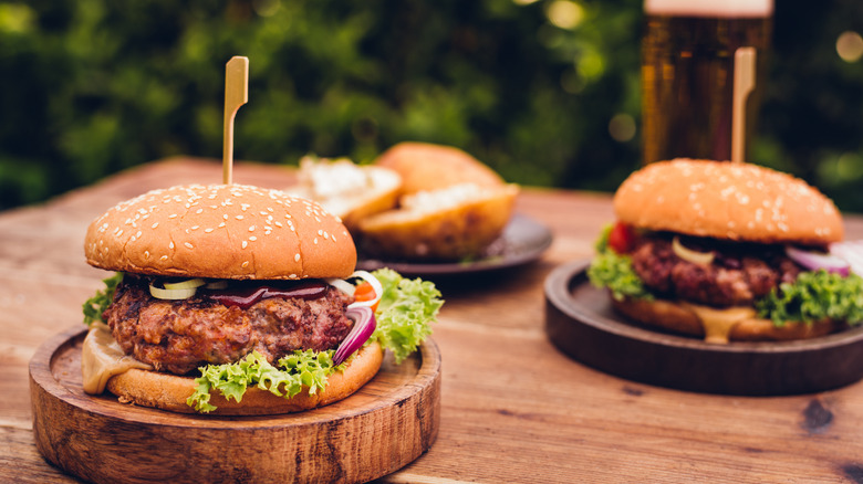 hamburgers on wood table