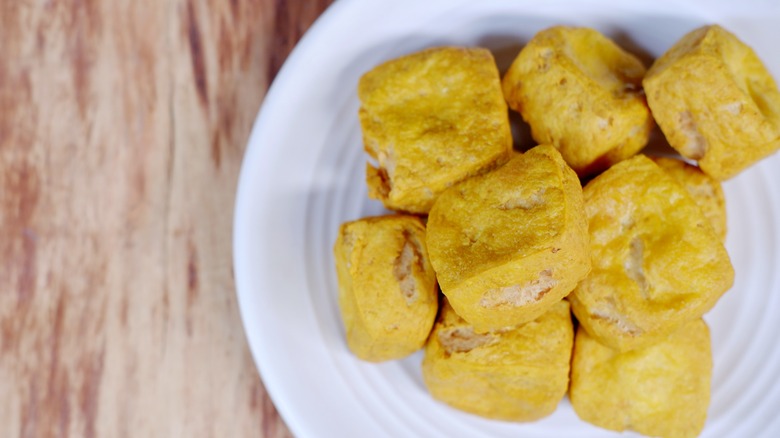 crispy fried tofu on a white plate