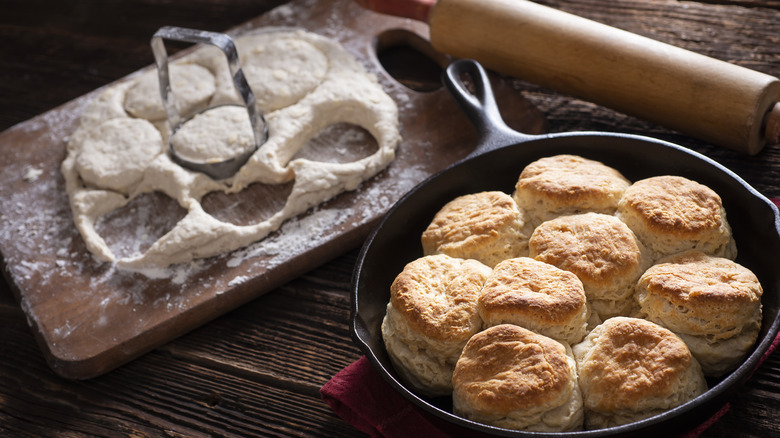 roll and cut biscuits beside dough