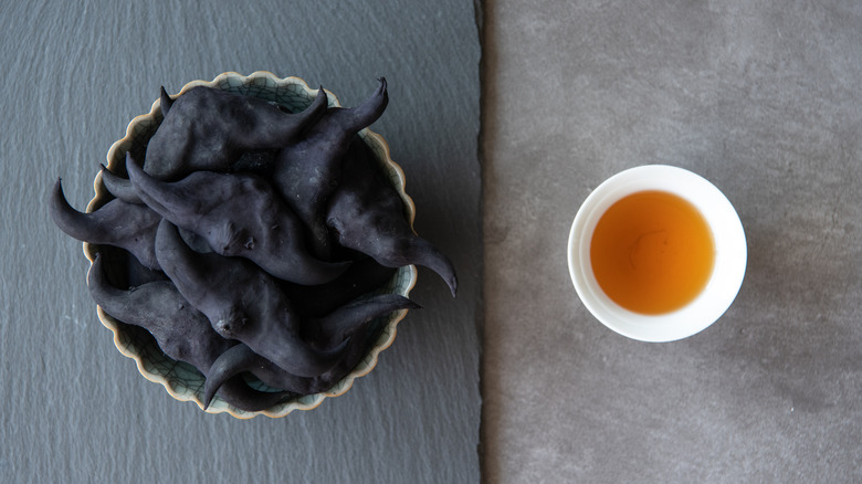 Bowl of water caltrops with cup of sauce