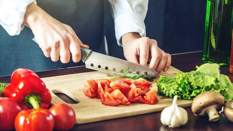  Person prepping vegetables with knife