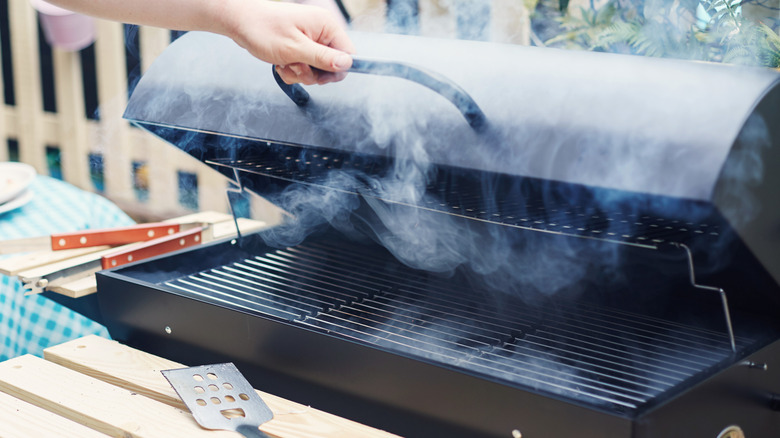 outdoor grill filled with smoke